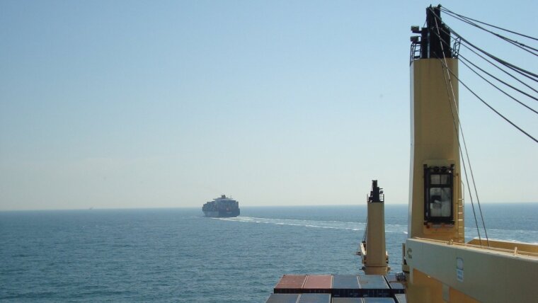 Seafaring: Front view of a cargo ship on the sea